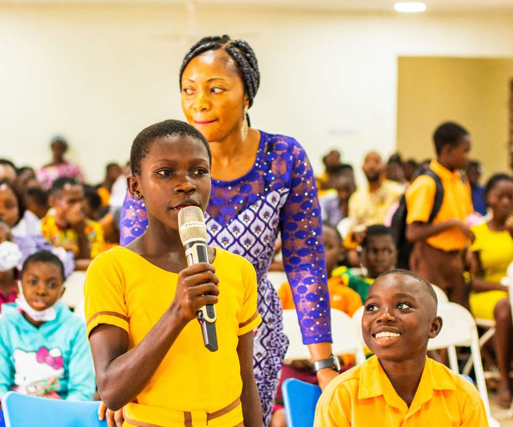 Ghanaian Female School Child Holding a Mic